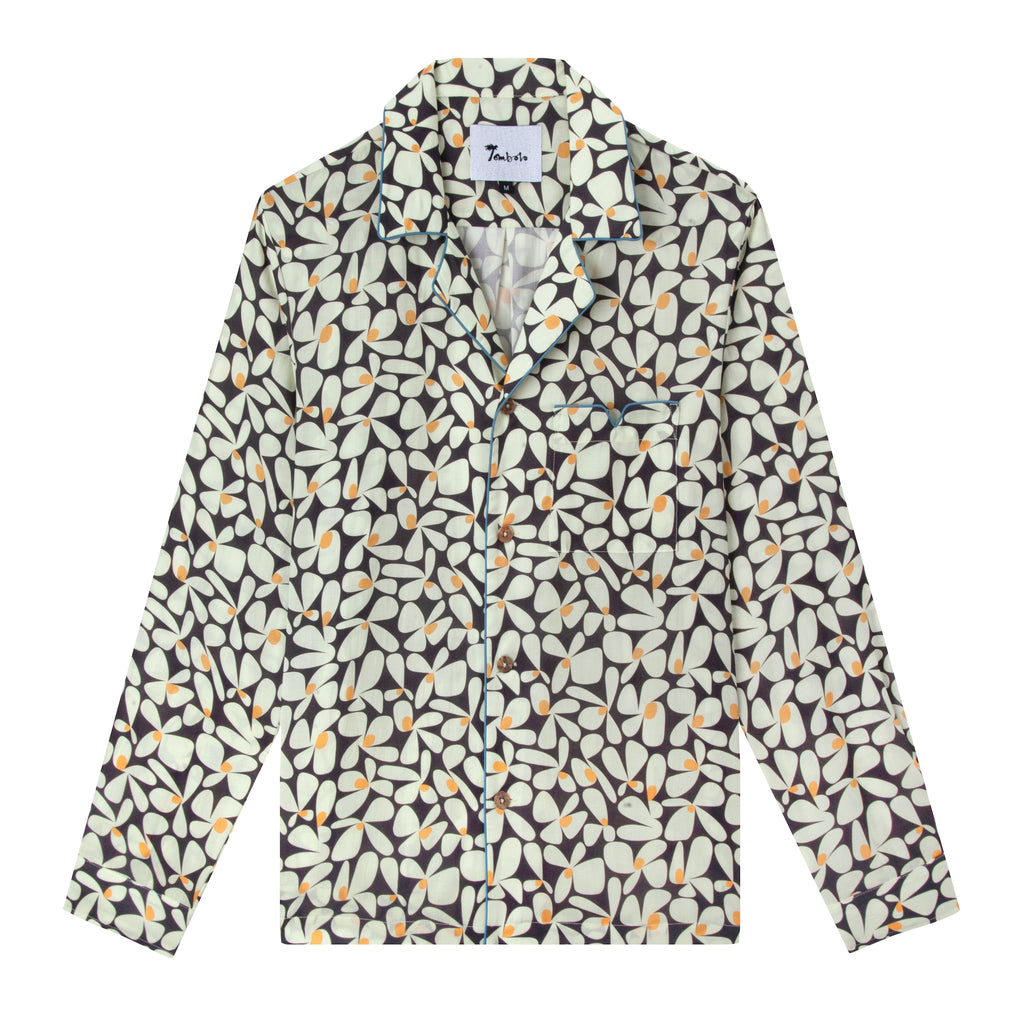 Product photo of shirt depicting the recurring 60s style daisy theme with blue piping on the pockets and collar