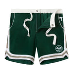 Unbuttoned and untied DSNY shorts with white drawstrings and DSNY logo