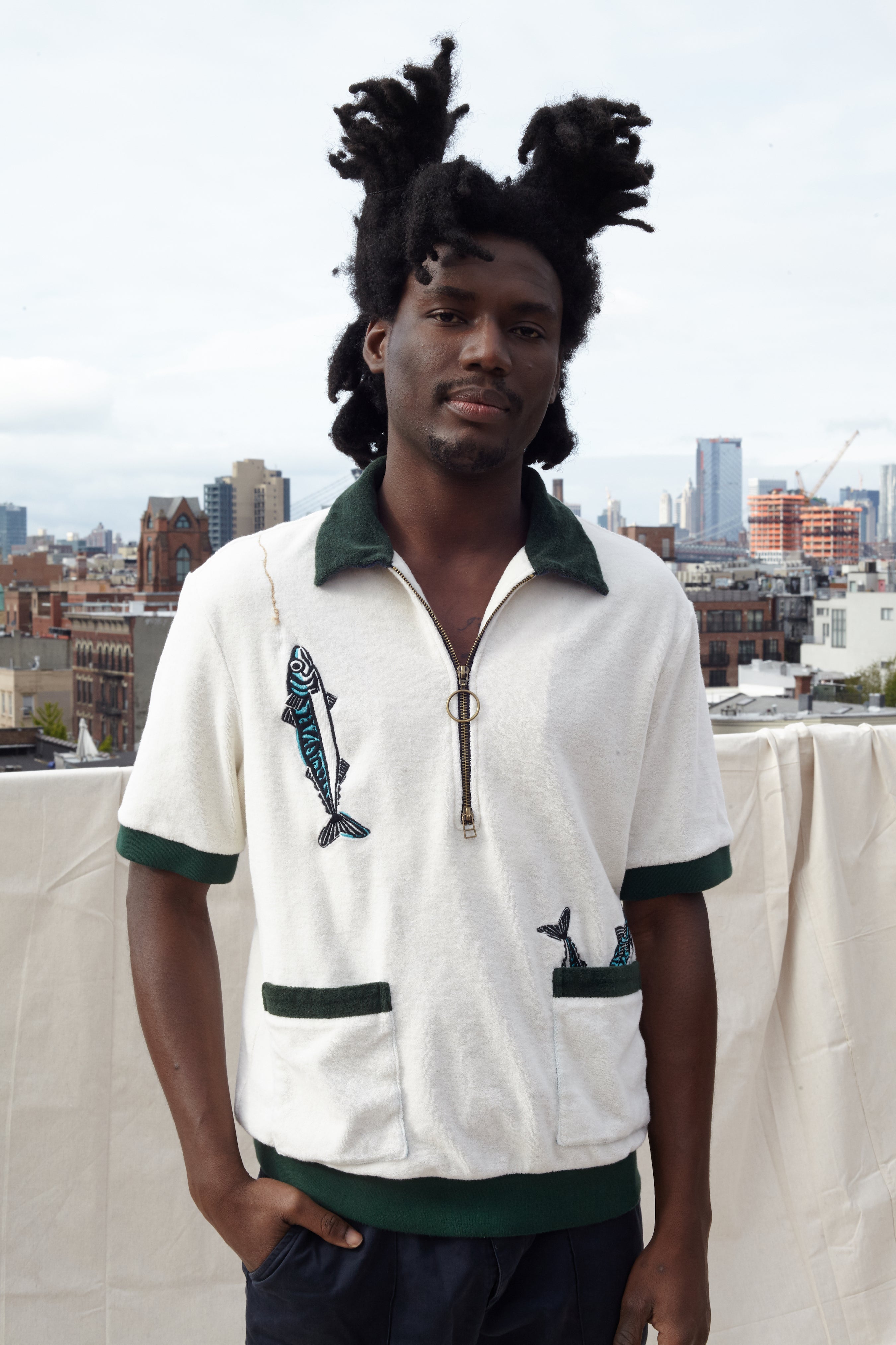 Male model wearing the cabana shirt on a rooftop in a city
