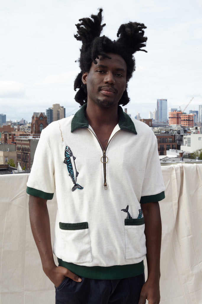 Male model wearing the cabana shirt on a rooftop in a city