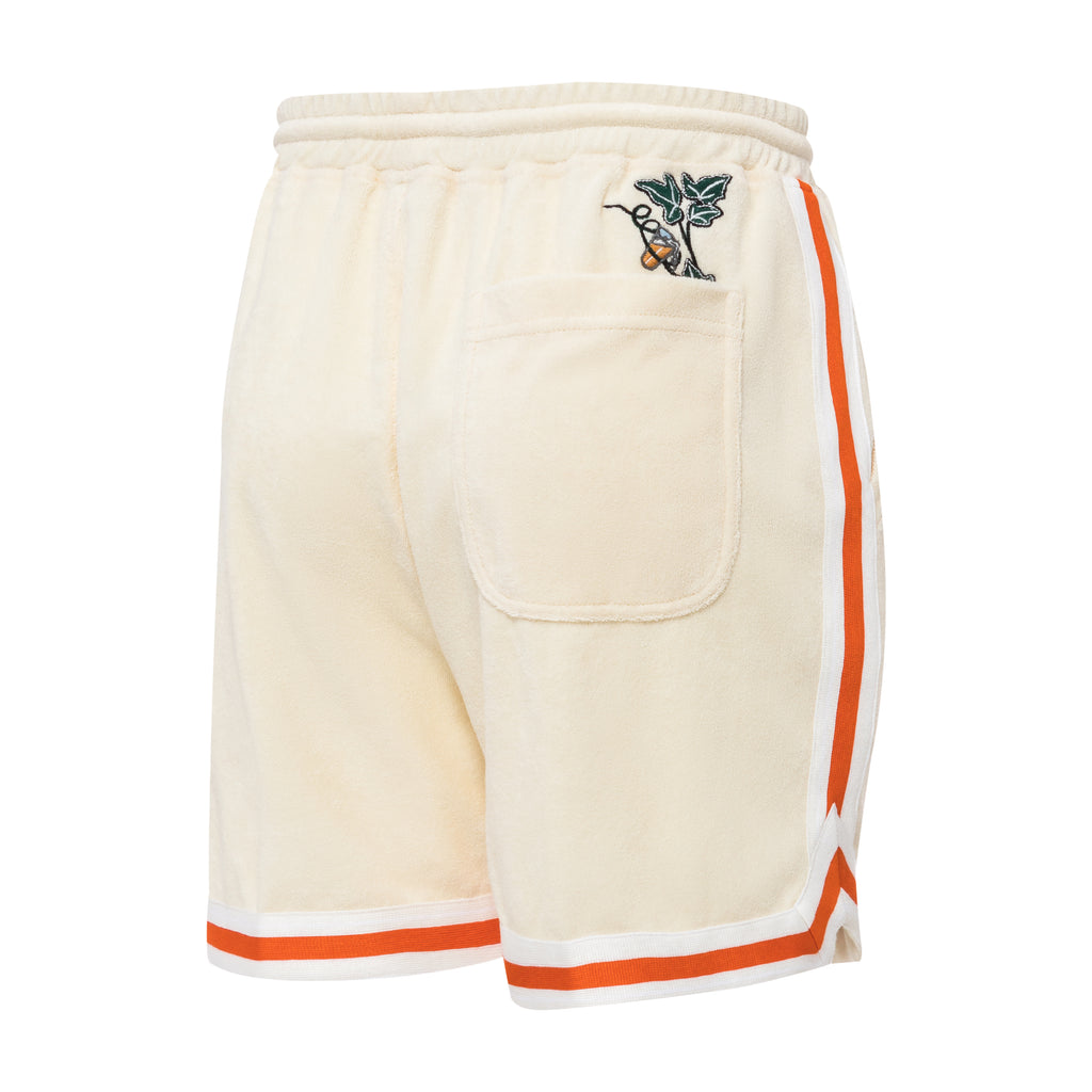 a left back side view of the shorts, once again showing the vine and beer peeking out of the pocket