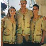 Paolo Sandulli alongside a male and female model, all three wearing the shirt