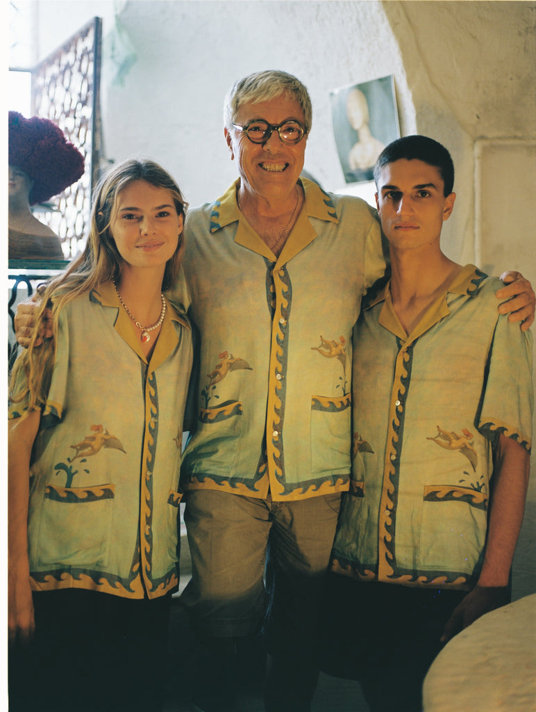 Paolo Sandulli alongside a male and female model, all three wearing the shirt