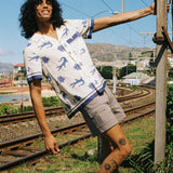 model holds onto telephone pole
