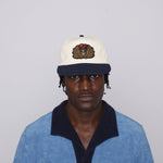 Closer view of male model wearing cap