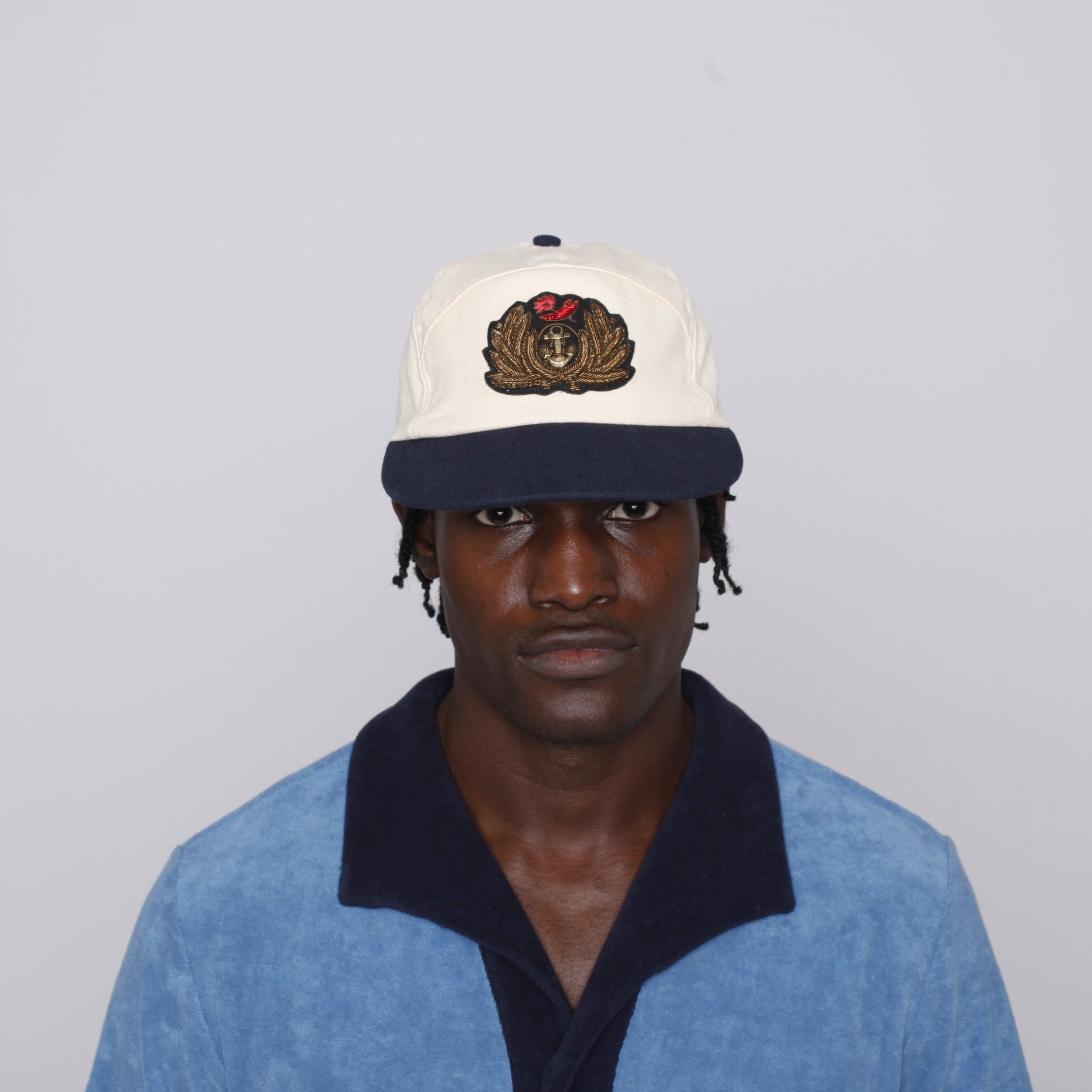 Closer view of male model wearing cap