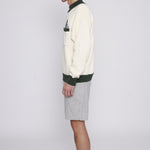 Side view of male model wearing the sweater
