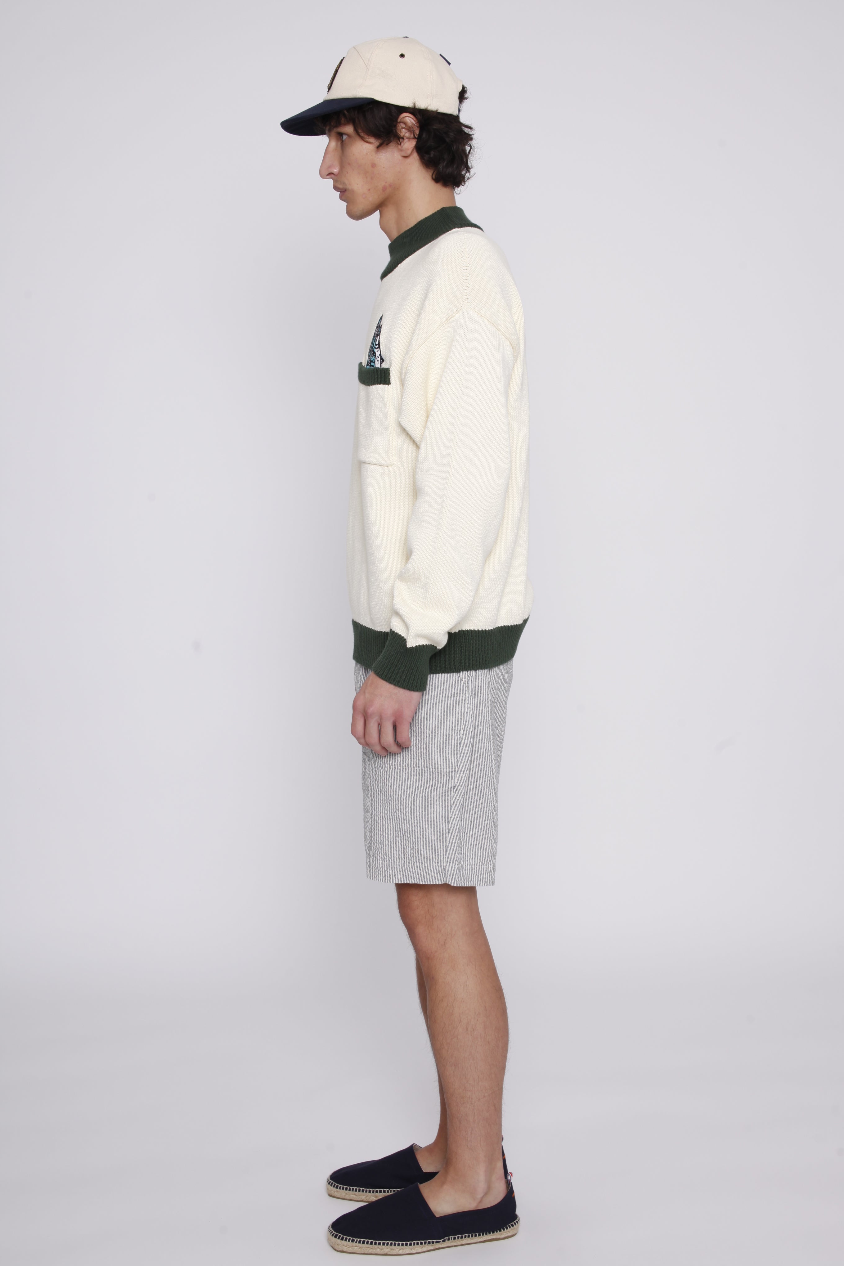 Side view of male model wearing the sweater