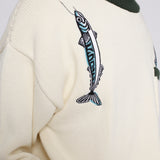 Close up of the embroidered over the shoulder fish and hook