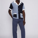 male model in studio with hand in pants pocket