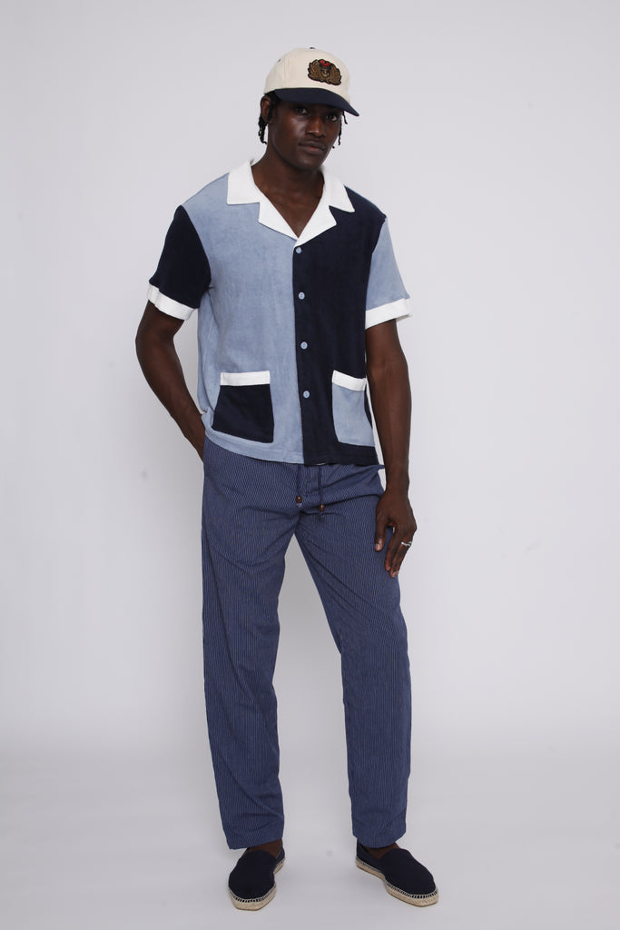 male model in studio with hand in pants pocket