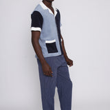 Male model gazing over left shoulder in the blues cabana