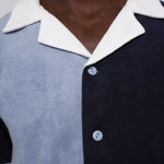 close up of male model in blues cabana depicting white collar