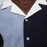 close up of male model in blues cabana depicting white collar