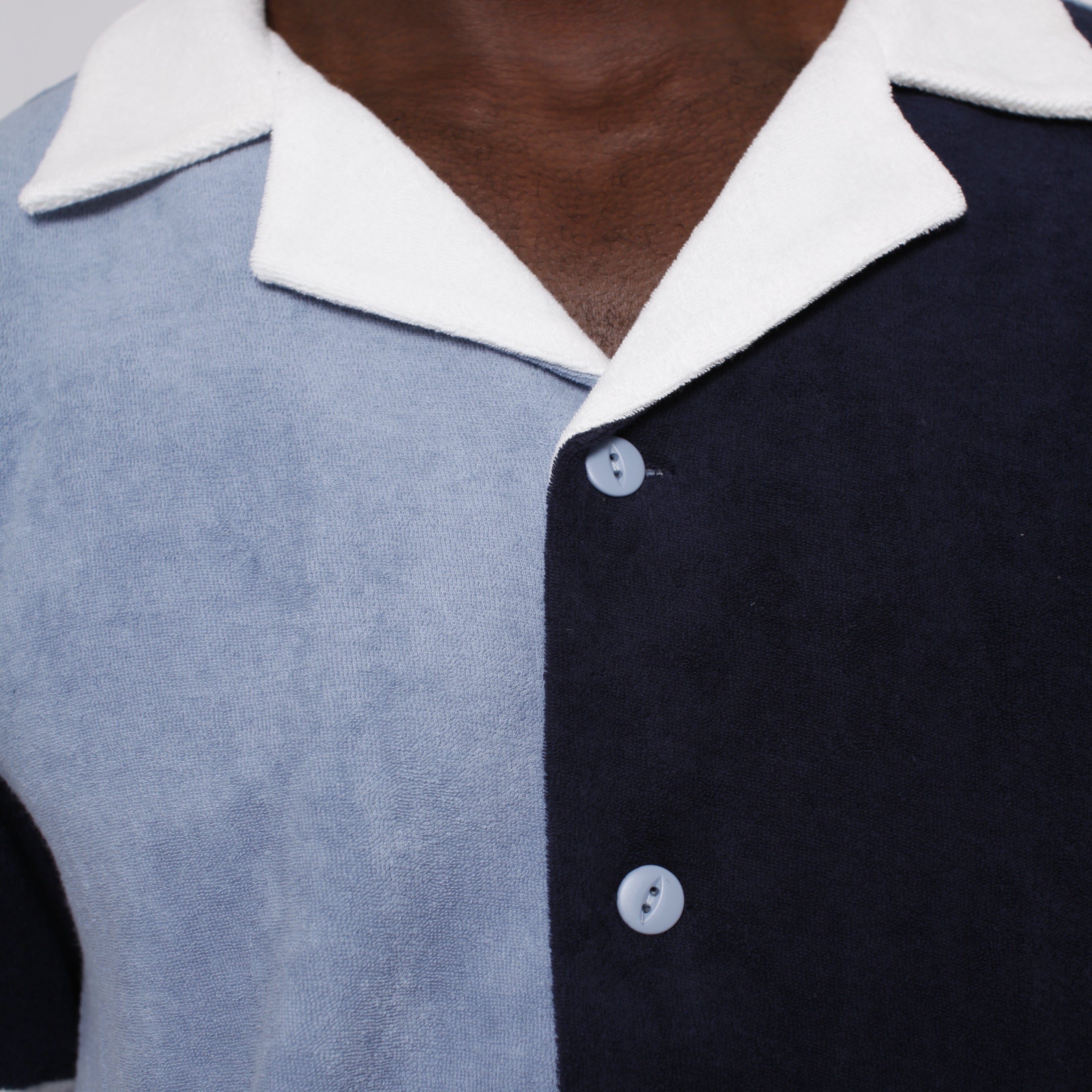 close up of male model in blues cabana depicting white collar