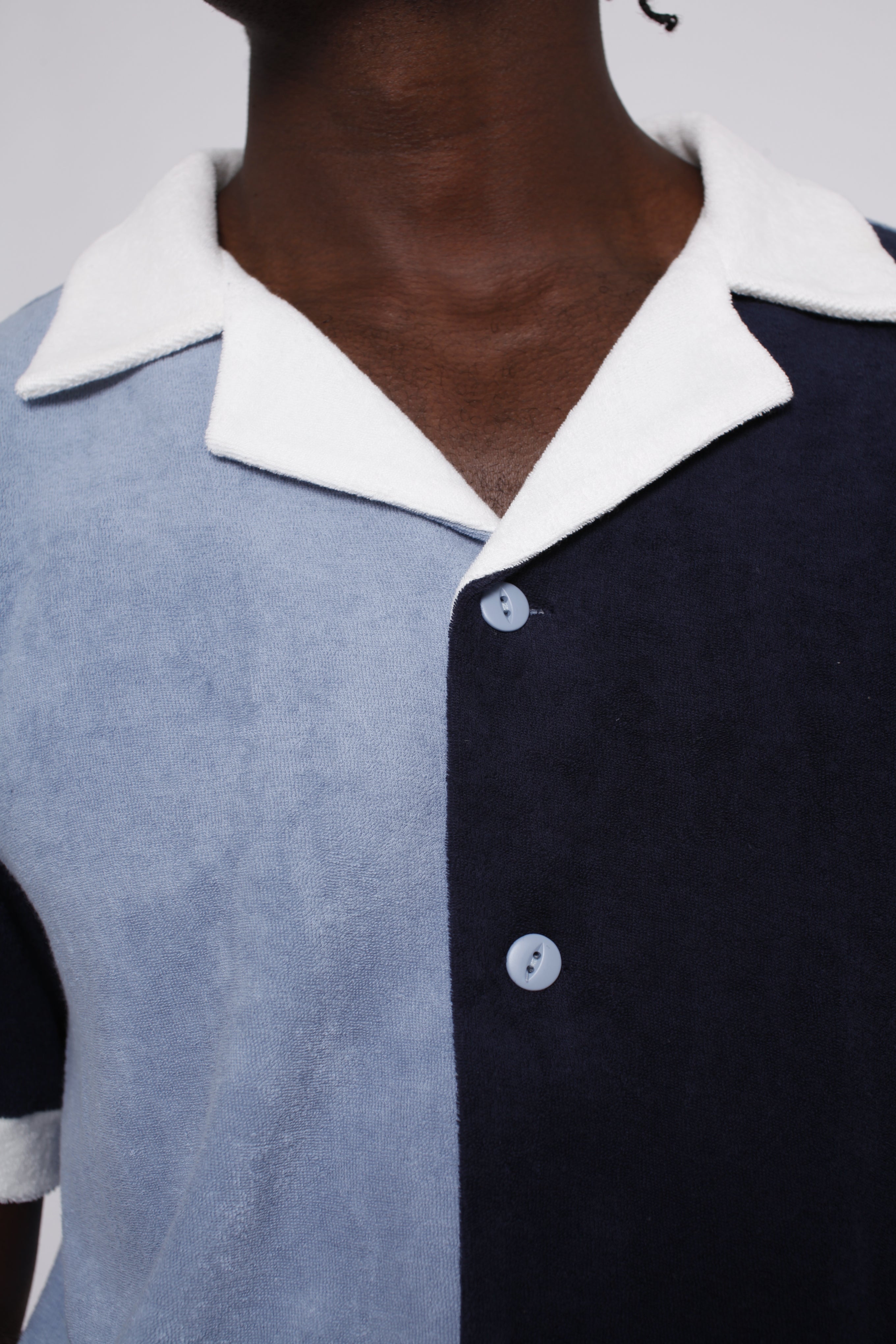close up of male model in blues cabana depicting white collar