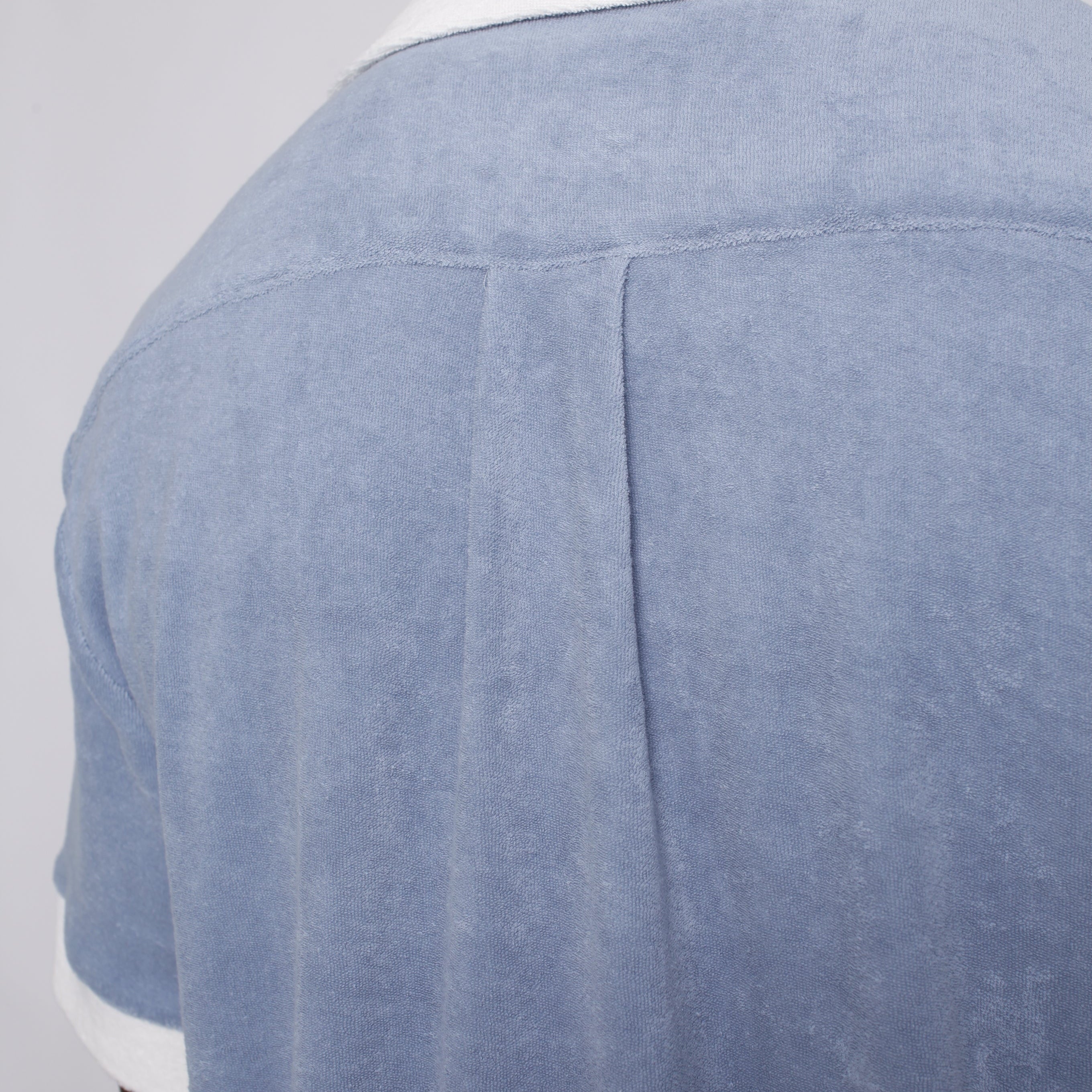 Back of blue shirt on model