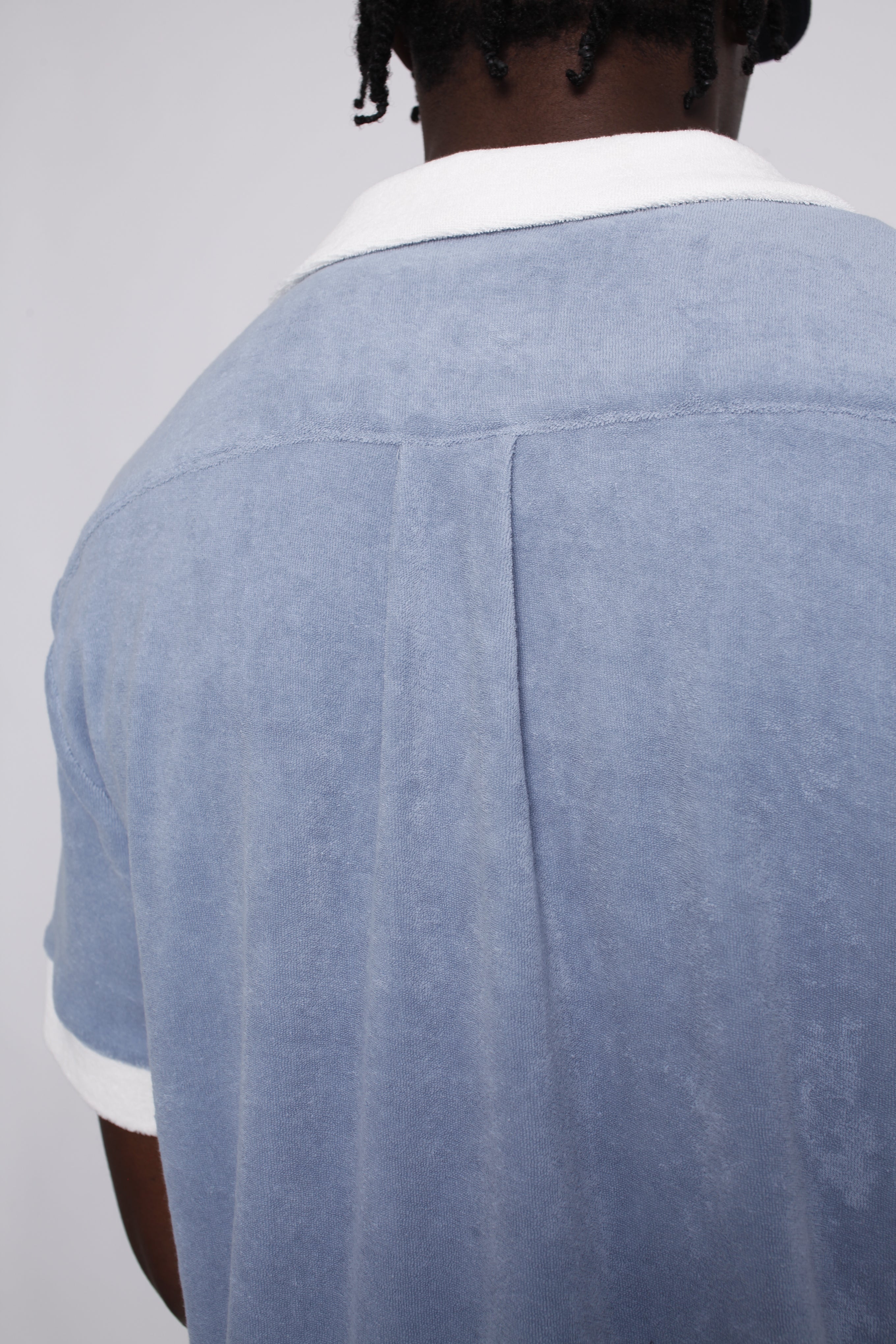 Back of blue shirt on model