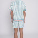 Back view of male model wearing shorts and cabana