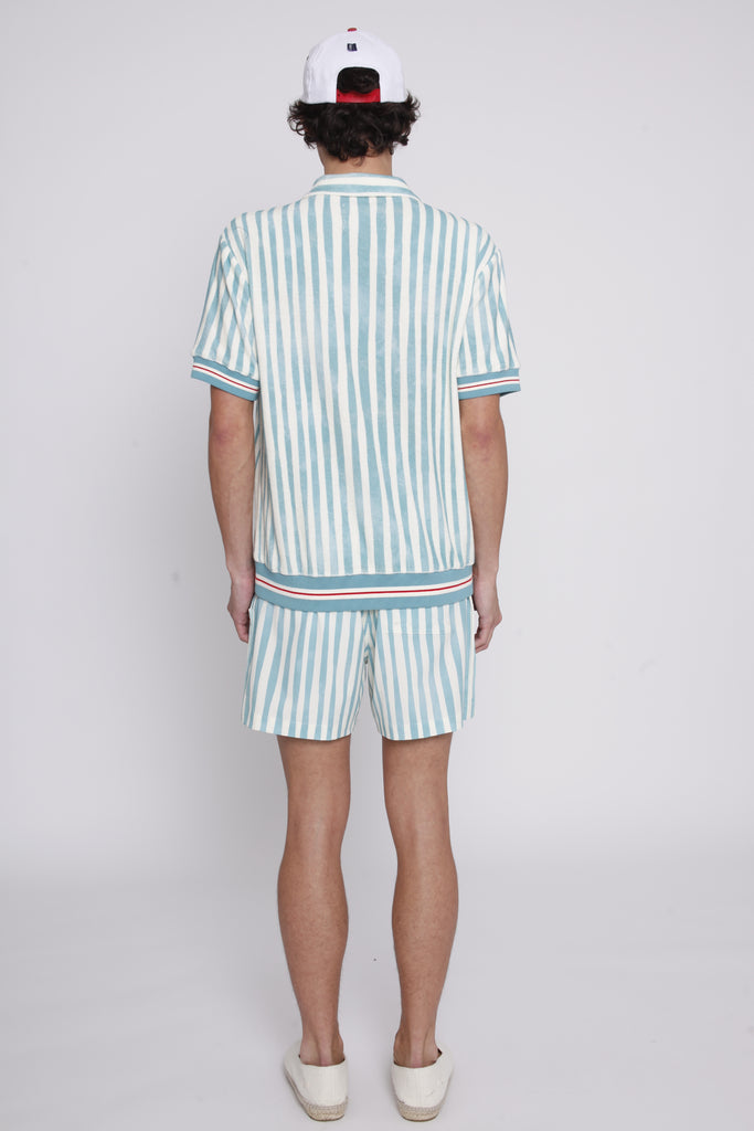 Back view of male model wearing shorts and cabana