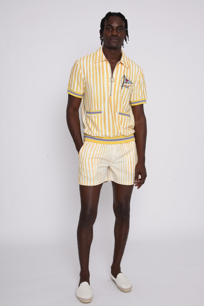 A person wearing a yellow and white striped shirt