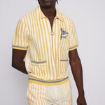 A person wearing a yellow and white striped shirt