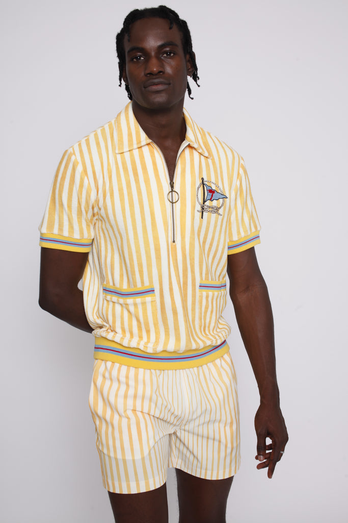 A person wearing a yellow and white striped shirt