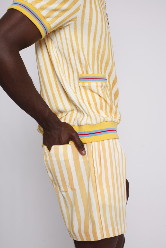 A person wearing a yellow and white striped shirt