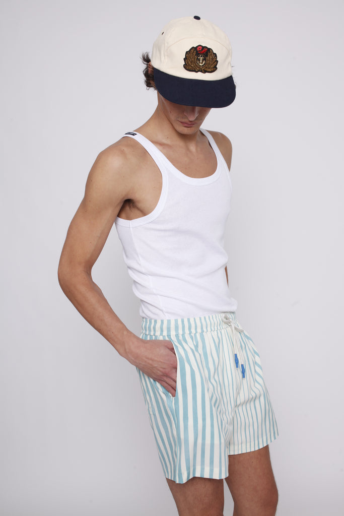 Male model looking down at hand in pocket