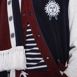 Close up of jacket partially unbuttoned over a navy and white striped shirt on male model
