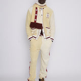 Male model in full set gazing at camera in photo studio