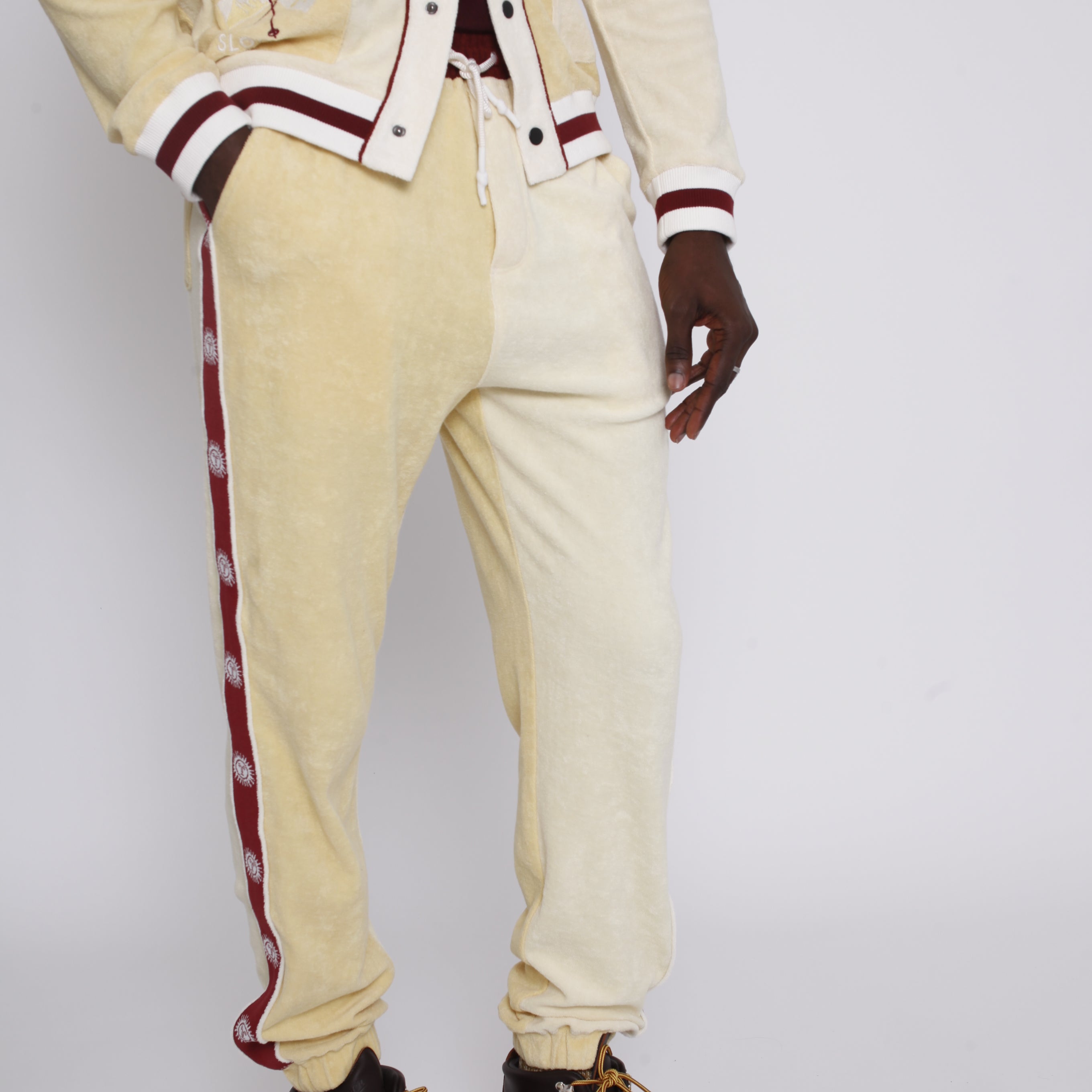 Male model wearing full apres ski set in yellow