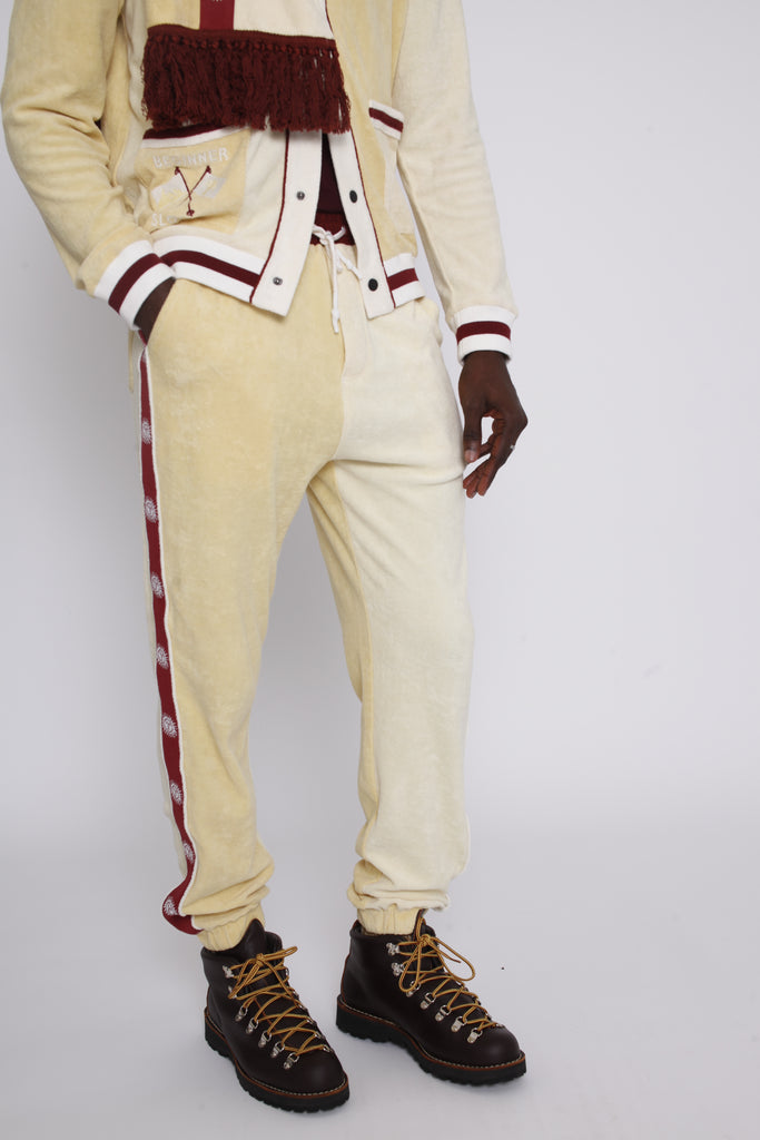 Male model wearing full apres ski set in yellow