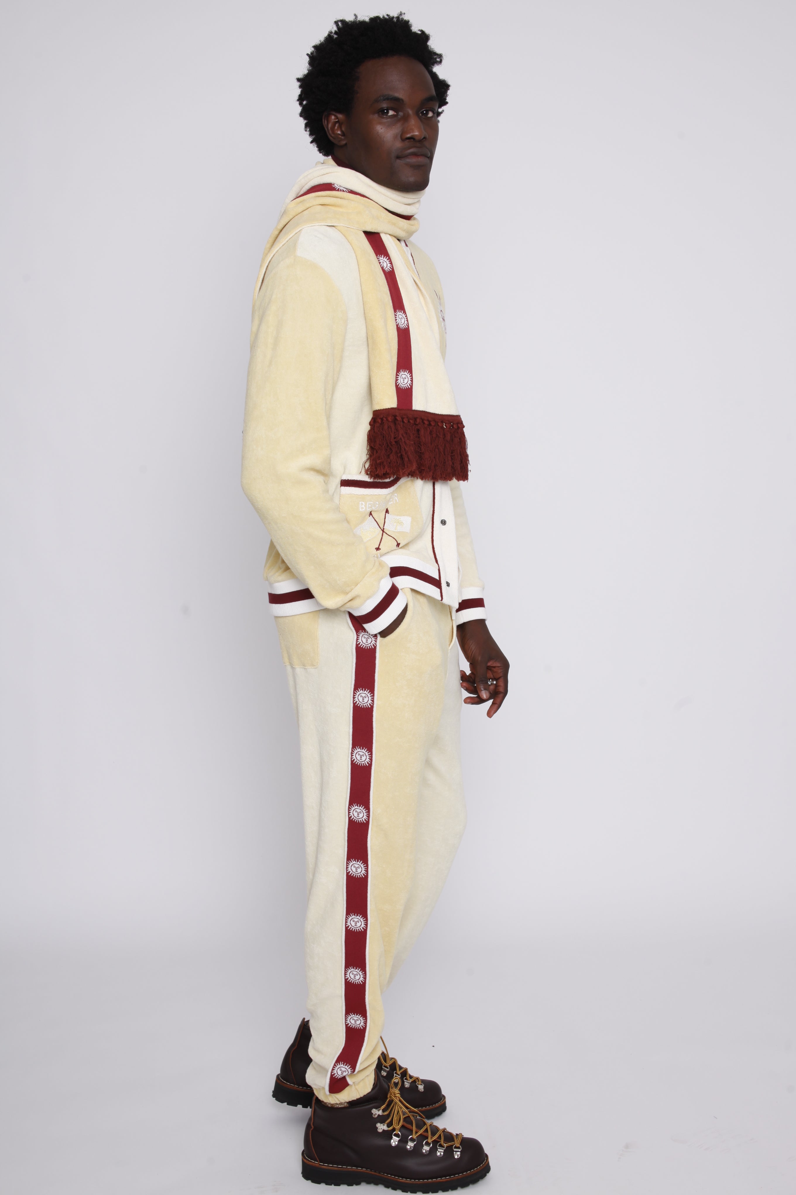 Male model in full apres ski cabana set looking over left shoulder in studio