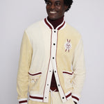 Male model smiling in cabana top with bottom three buttons undone