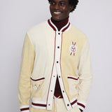 Male model smiling in cabana top with bottom three buttons undone