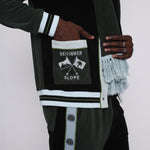 male model putting hand in left pocket embroidered with the words beginner slope