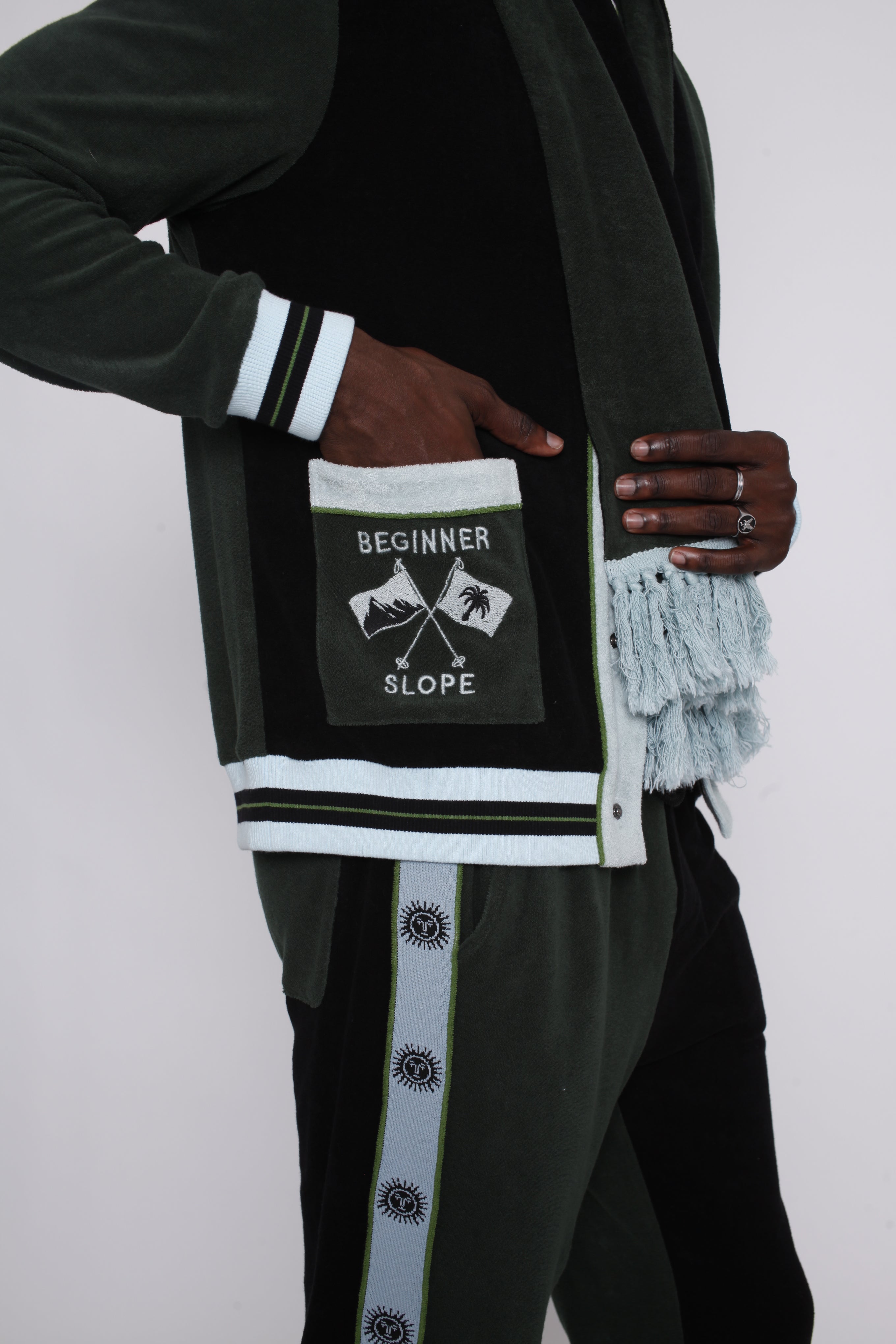 male model putting hand in left pocket embroidered with the words beginner slope