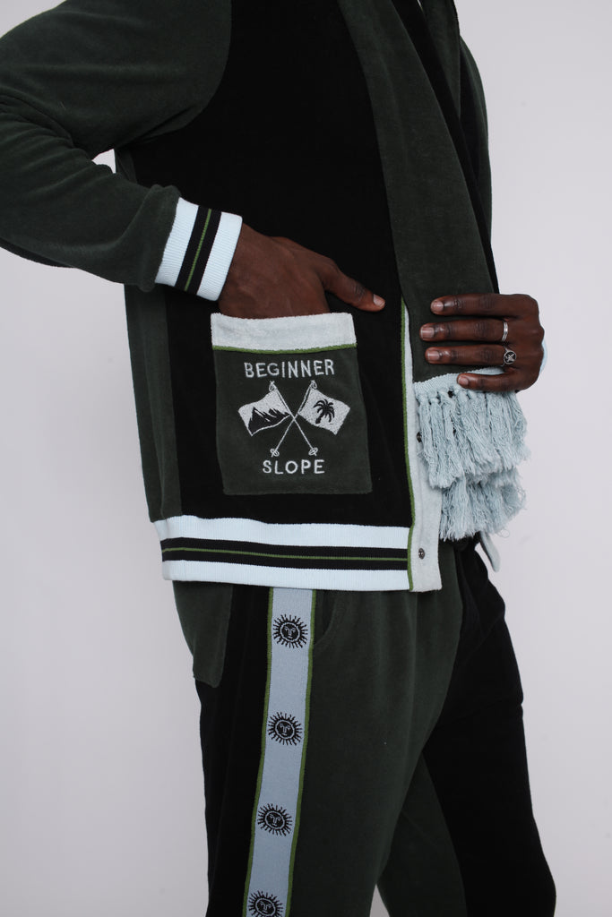 male model putting hand in left pocket embroidered with the words beginner slope