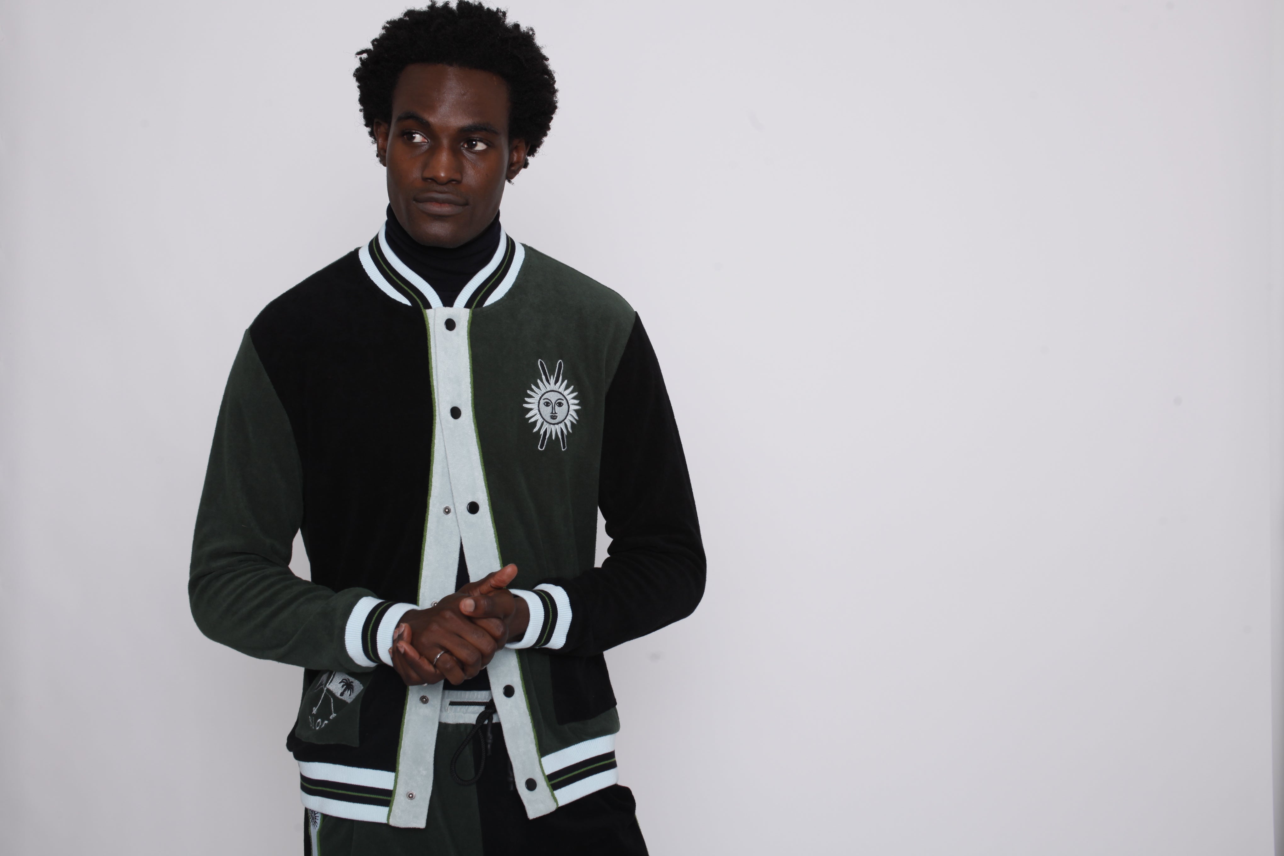 male model rubbing hands together in the full set in studio