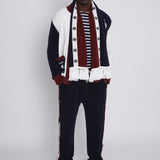 Male model wearing full set with scarf in a photo studio