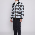 Male model facing left in black diamond cabana