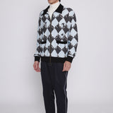 Male model facing left in black diamond cabana