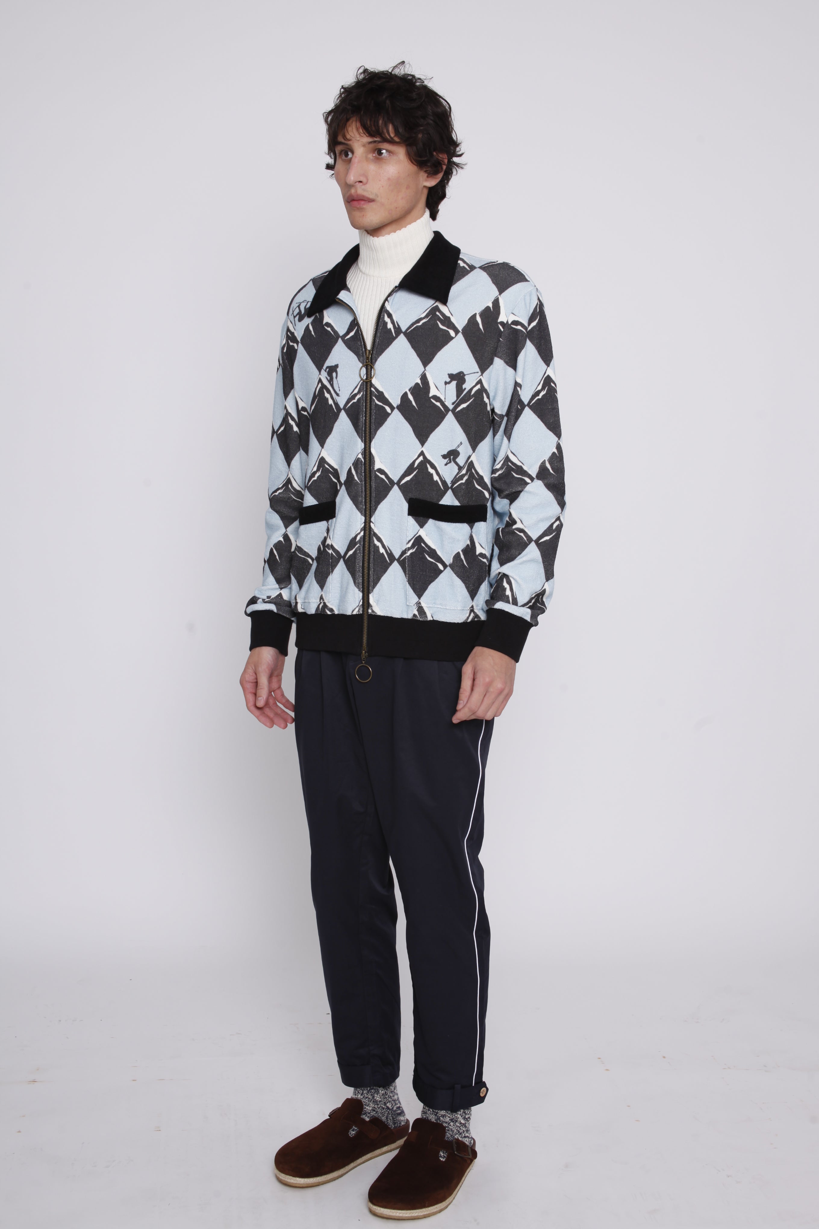 Male model facing left in black diamond cabana