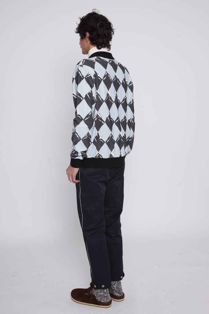 Back view of male model in same outfit now showing his birkenstock boston clogs