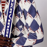 close up of maroon detailing on the diamond alp print