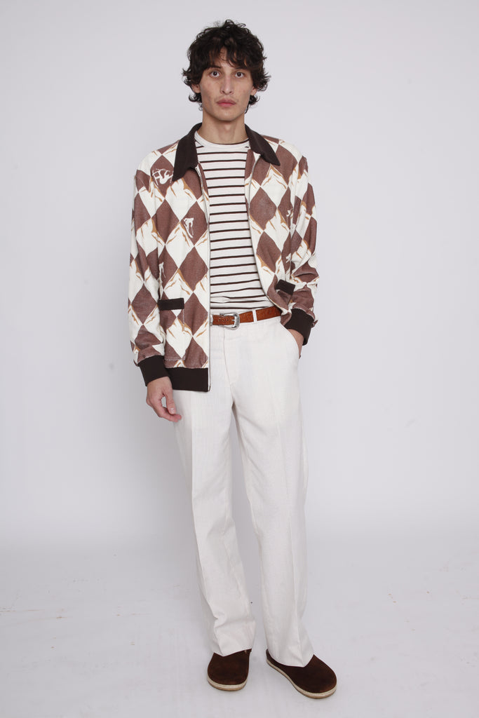 Man with hand in pocket and unbuttoned Black Diamond Cabana stares at camera