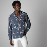male model posing in top with right hand in his pocket