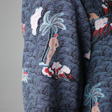 Close up of left sleeve showing the print with a naked backside Adam leaning on a palm tree