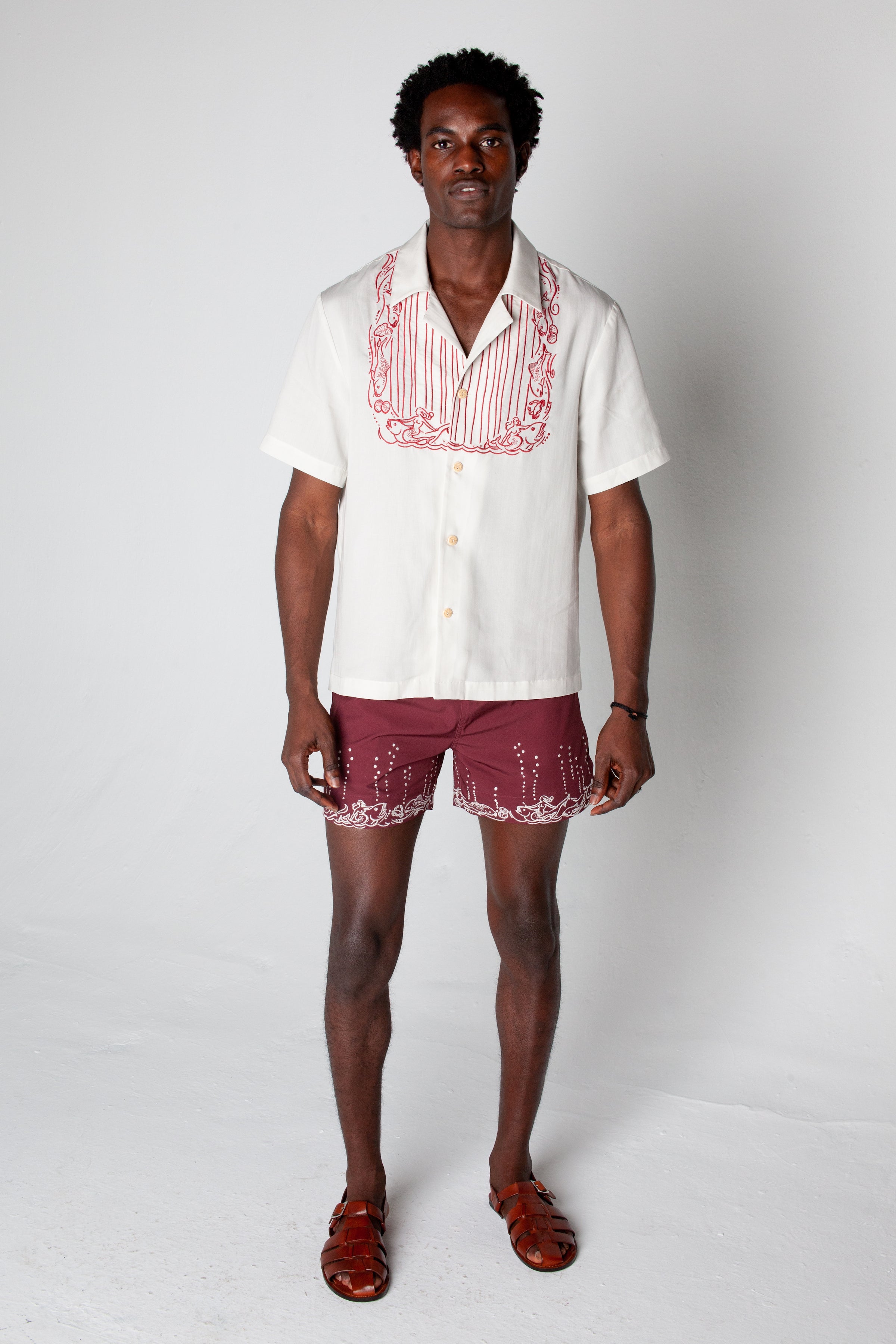 Male model wearing the Fruits De Mer trunks with the matching top